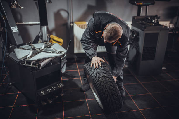 istock Mechanic doing car tire service 1884378647
