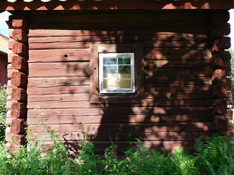An old window on an eqully old wooden building
