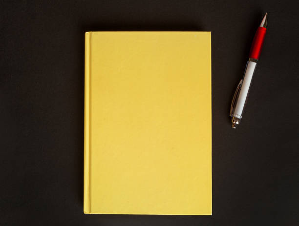 istock Copybook Mockup, Yellow Notebook on Office Desk with Copy Space for Text, Moleskin Template 1884440516