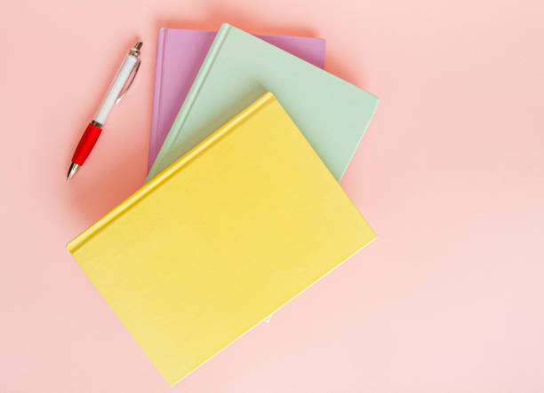 istock Copybook Mockup, Pink Notebook on Office Desk with Copy Space for Text, Moleskin Template 1884440526