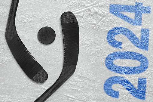 Concept, hockey season. Hockey accessories on the ice arena