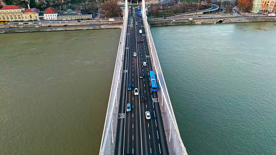 Captured From a High Angle Drone,the Elisabeth Bridge Over the Danube River in Budapest,Hungary,Becomes a Tapestry of Motion as Vehicles Traverse its Iconic Structure. The Aerial View Provides a Dynamic Perspective of the Bridge