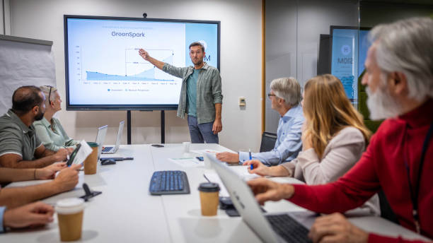 istock Man giving presentation in meeting room 1884459431