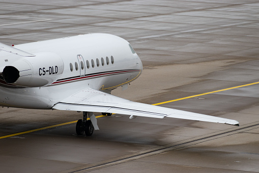 Zurich, Switzerland, December 6, 2023 CS-DLD Dessault Falcon 2000EX aircraft is taxiing on the apron
