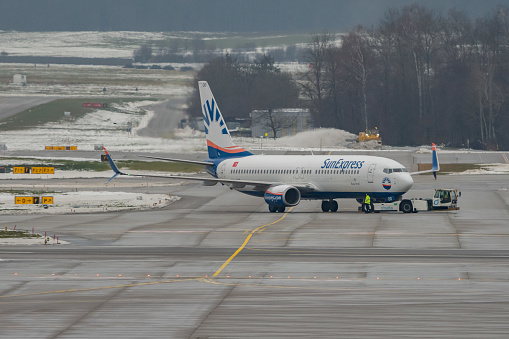 Zurich, Switzerland, December 6, 2023 Sun Express Boeing 737-800 aircraft is pushed from the gate