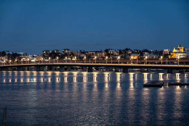 Stockholm, Sweden, The new Lidingo Bridge at night and reflections.
