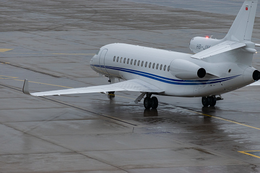 Zurich, Switzerland, December 6, 2023 HB-JIM Dessault Falcon 8X aircraft is taxiing on the apron
