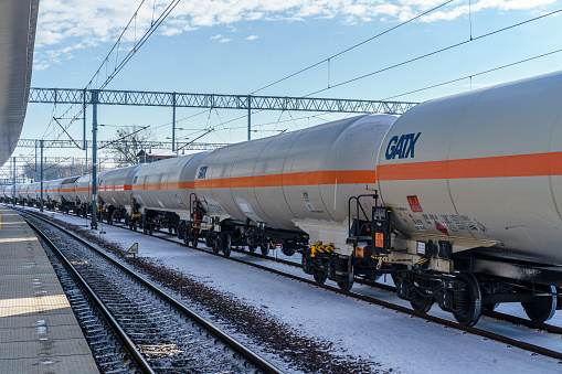 Trzebinia, Lesser Poland, Poland - 30 November 2023: rail tankers for propane gas from GATX, a company that leases railcars in Europe, standing at the railroad station in Trzebinia