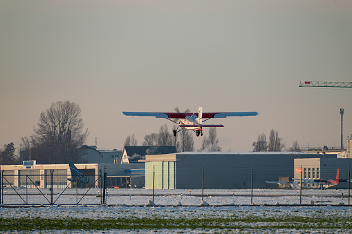 Altenrhein Airport, Saint Gallen, Switzerland, December 7, 2023 HB-FKH Pilatus PC-6/B2-H4 Turbo Porter propeller aircraft is taking off from runway 28