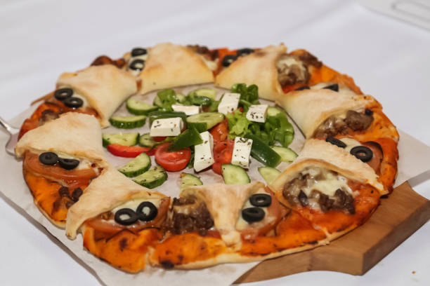 istock Pizza with mozzarella cheese and olives on a white background 1884515384