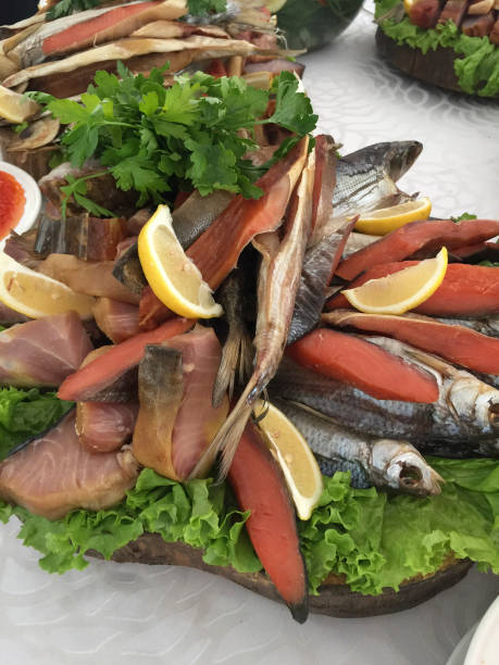 istock Assorted fish with lemon and parsley on a plate in a restaurant 1884515914