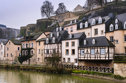 Traditional houses in the district of the Grund in the city of Luxemburg, on the banks of the Alzette river with winter atmosphere.