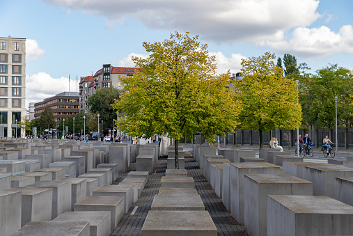Berlin, Germany - September 24, 2023: A picture of the Memorial to the Murdered Jews of Europe and some trees nearby.
