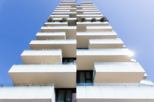 White balconies in a modern apartment building in Milan, Italy