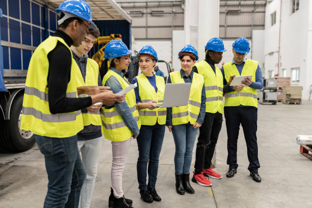 istock group of engineering workers in the logistics factory 1884575870