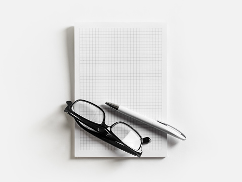 Photo of blank copybook, glasses and pencil. Responsive design mockup. Flat lay.
