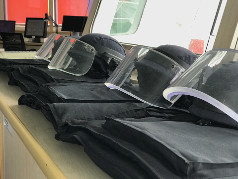 Bullet proof body armour and helmets kept in the bridge of a merchant ship at sea. These are put on by the bridge team during a security threat.