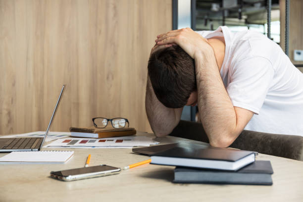 istock Tired man working in office, work in office concept 1884654105