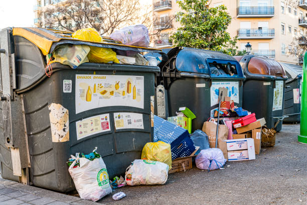 Recycling garbage containers in Valencia street Valencia, Spain. Dec, 25-2023. Recycling containers full of garbage in Valencia street overflowing dumpster stock pictures, royalty-free photos & images