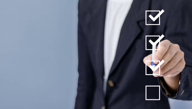 istock checklist concept businessman check mark on check box with check mark. 1884719853