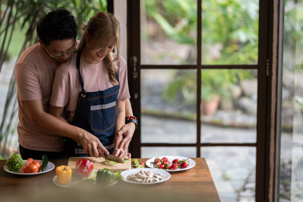 istock Young couple in love in the kitchen 1884743317
