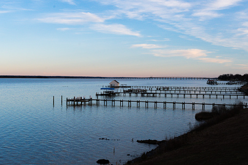 Tappahannock, Virginia, USA - Boat Docks on the Rappahannock River at Golden hour with the Downing Bridge in the background