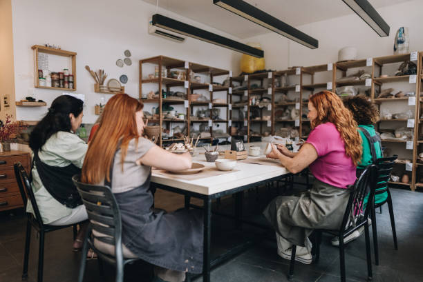 istock Friend potters on pottery class at a ceramics workshop 1884762304