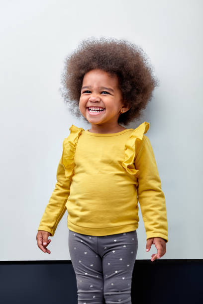 istock Cute multiracial little girl with a funny expression isolated on white background 1884766743