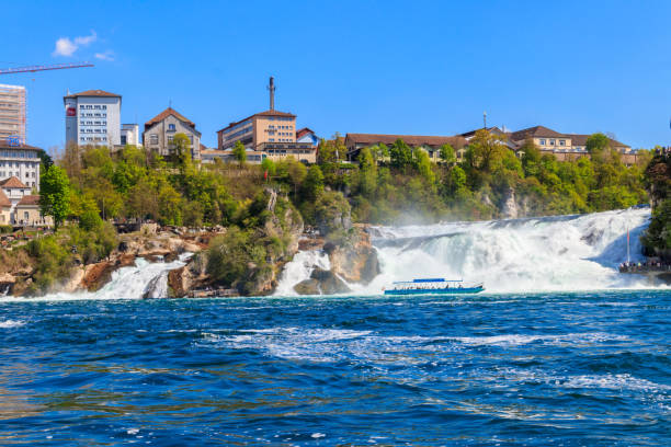 sightseeing boat with tourists sailing close to the rhine falls, most powerful waterfall in europe - 5905 stock-fotos und bilder