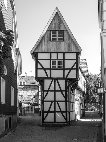 Hattingen, Germany - August 7, 2022: The Iron House is a half-timbered house built in 1611 in the Old Town Hattingen (Altstadt), North Rhine-Westphalia. Black and white photography.