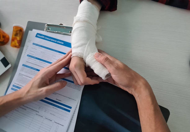 Broken arm at doctor appointment in clinic. Concept of drug treatment of intra-articular fractures and medical insurance