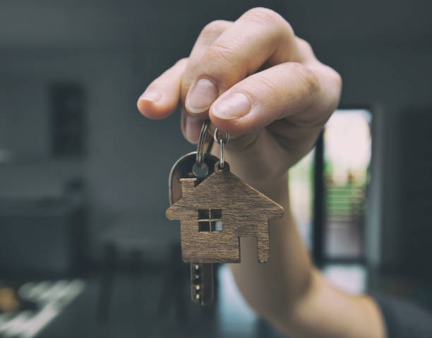 istock The metal key in the woman's hand 1884785481