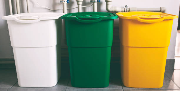 istock Three colorful trash cans for sorting garbage. For plastic, glass and paper 1884785797
