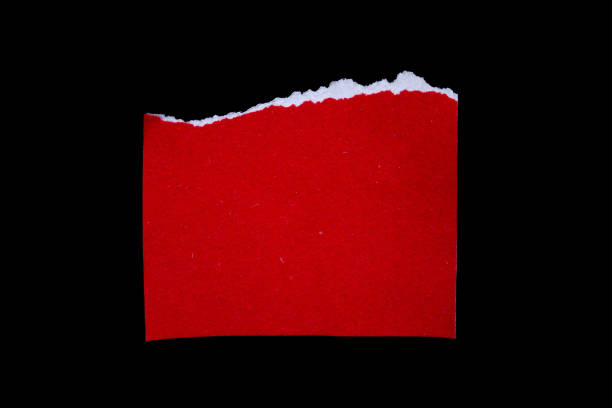 istock Ripped red paper piece isolated on a black background 1884815108