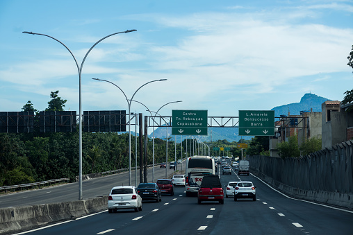 Rio de Janeiro, Brazil - December 24, 2023: POV traffic on the Linha Vermelha highway in Rio de Janeiro, Brazil. The main highway from the international airport to the tourist zone