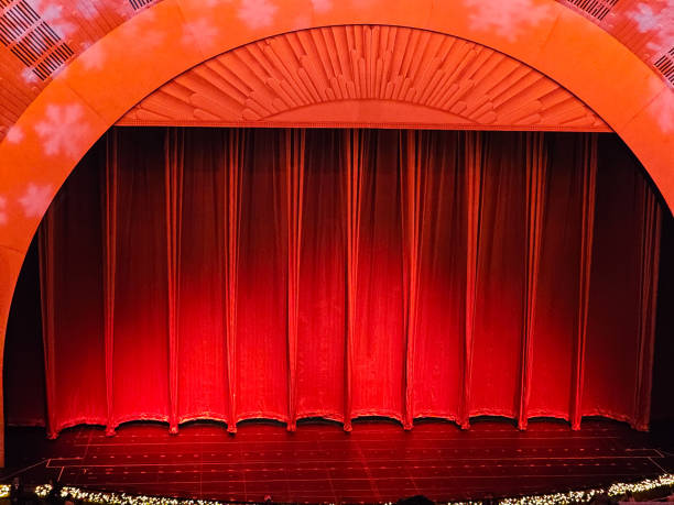 istock Red curtain across stage 1884820396