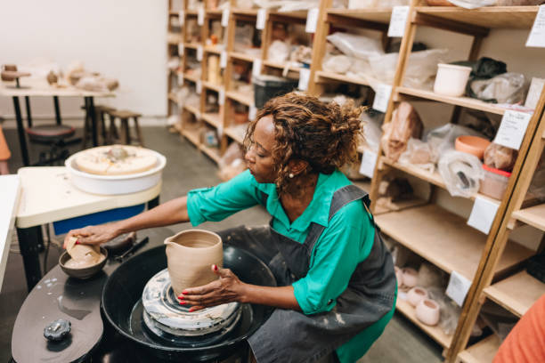 istock Senior woman making a vase on a ceramics workshop 1884835486