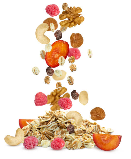 istock Muesli with berries and nuts fall into a heap. 1884842343