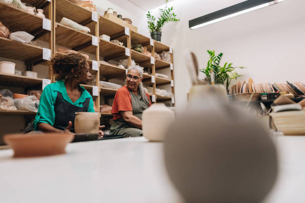 istock Friends potters talking on pottery class at a ceramics workshop 1884846034