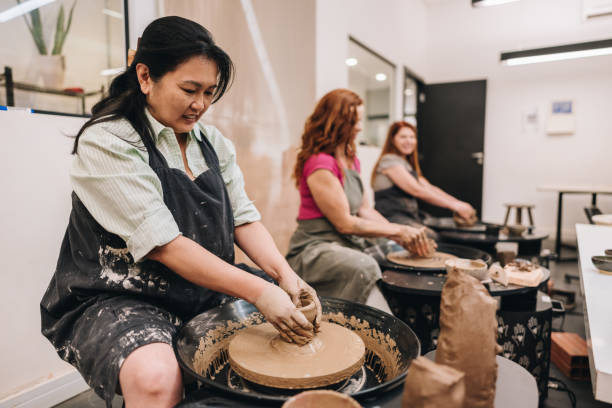 istock Mature woman on pottery class at a ceramics workshop 1884847088