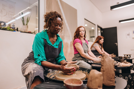 Senior woman on pottery class at a ceramics workshop