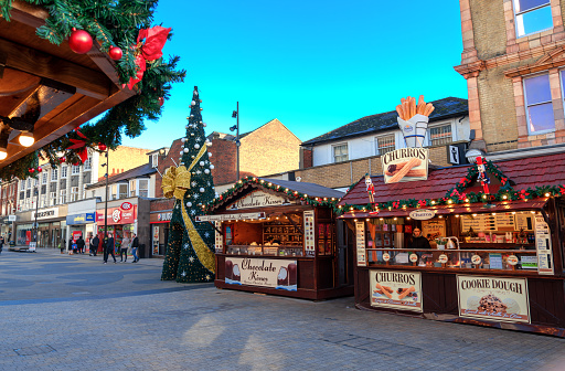 London, England, UK - December 26, 2023: Bromley Christmas Market with traditional stalls selling sweets and souvenirs on a sunny day over the festive period
