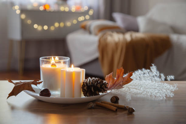 istock autumn and winter home decor with burning candles 1884912539