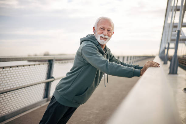 istock Mature man stretching outdoors 1884921781