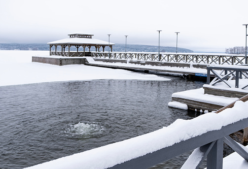 The coastal part of Lahti, Lake Vesijärvi in the winter and an ice hole. City park in the Mukkula area of Lahti Finland