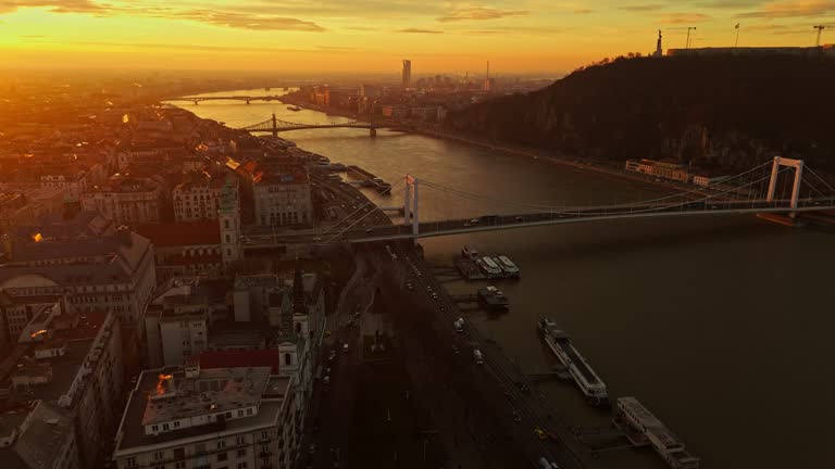 Drone Footage of Elisabeth Bridge over Danube River by Cityscape During Sunset in Budapest,Hungary