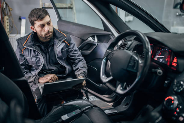 istock Mechanic doing car diagnostic in auto repair shop 1884939014