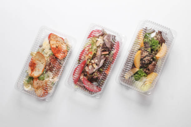 istock Different Salads in a plastic box on a white background. Tekaway food. 1884959774