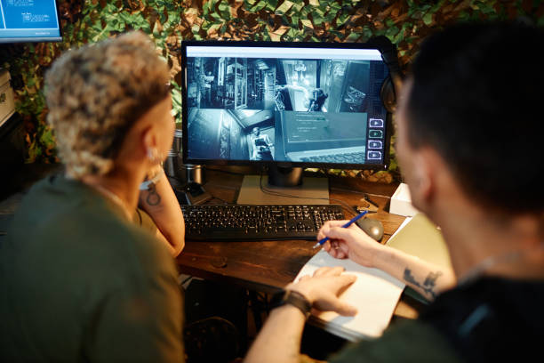 istock Focus on surveillance camera on computer screen standing on desk 1884974279