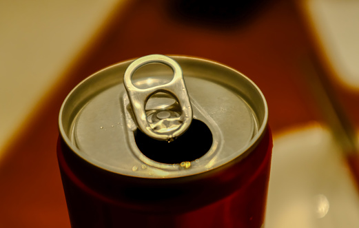 Close-up of the top of the beverage aluminum can. Food and drink.